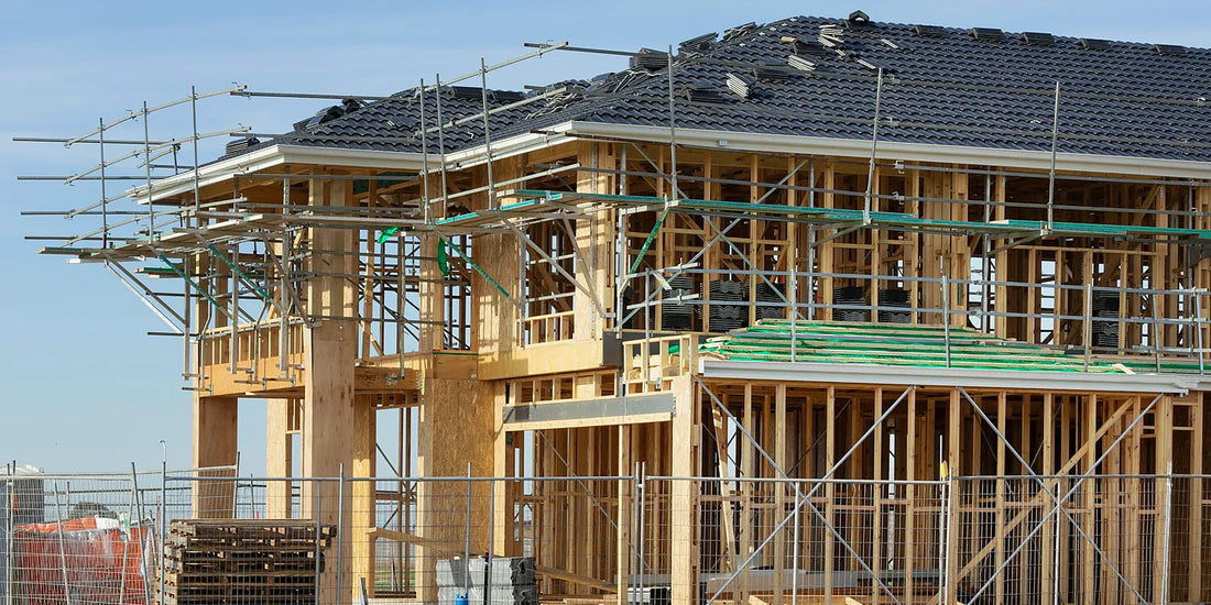 Two storey timber wall frame with scaffolding on an Australian house under construction