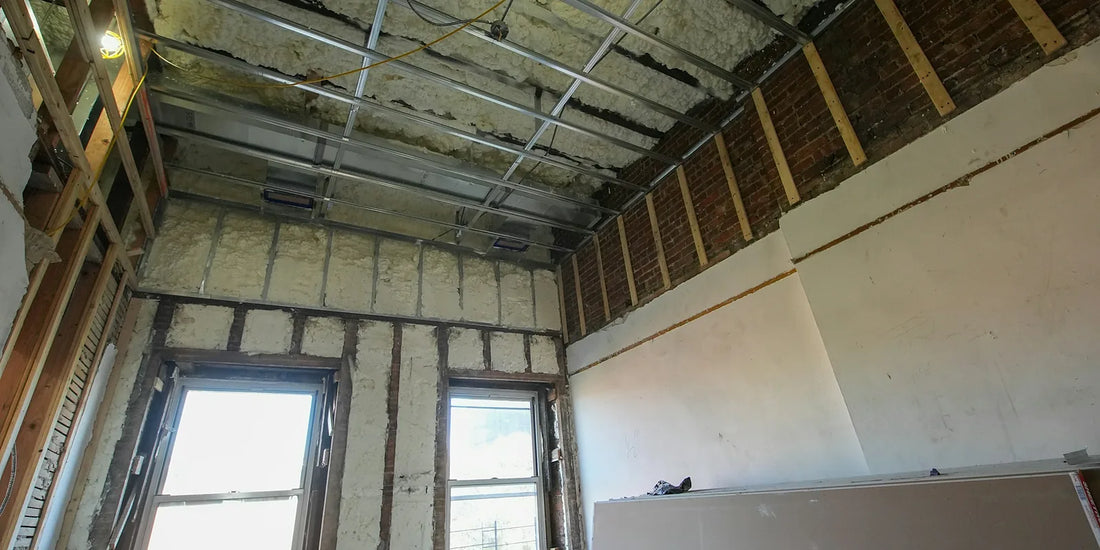 Attic room under construction with insulation between the framing and plasterboard ready to fix