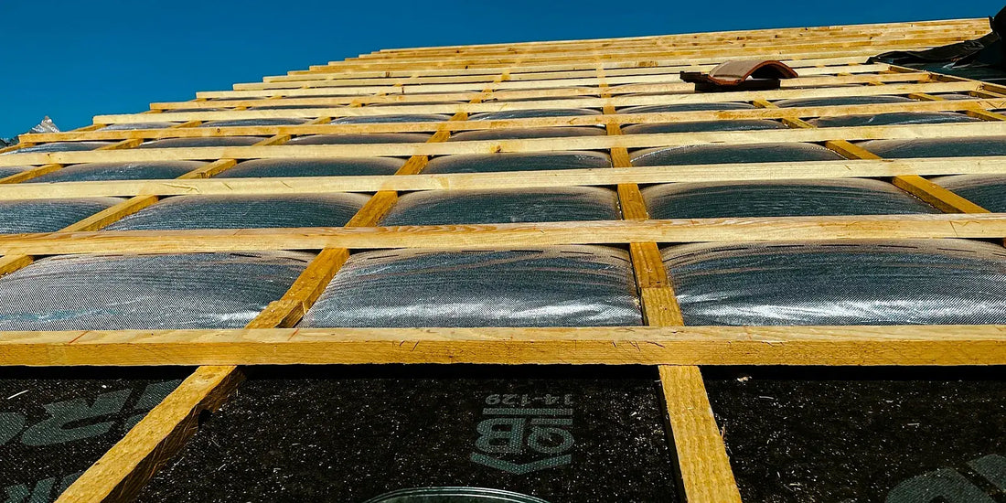 Timber battens fixed over a reflective insulation layer on a roof under construction