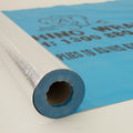 Rhino Wrap Breather roll partly unrolled, foil face on the roll and blue printed mesh face laid out
