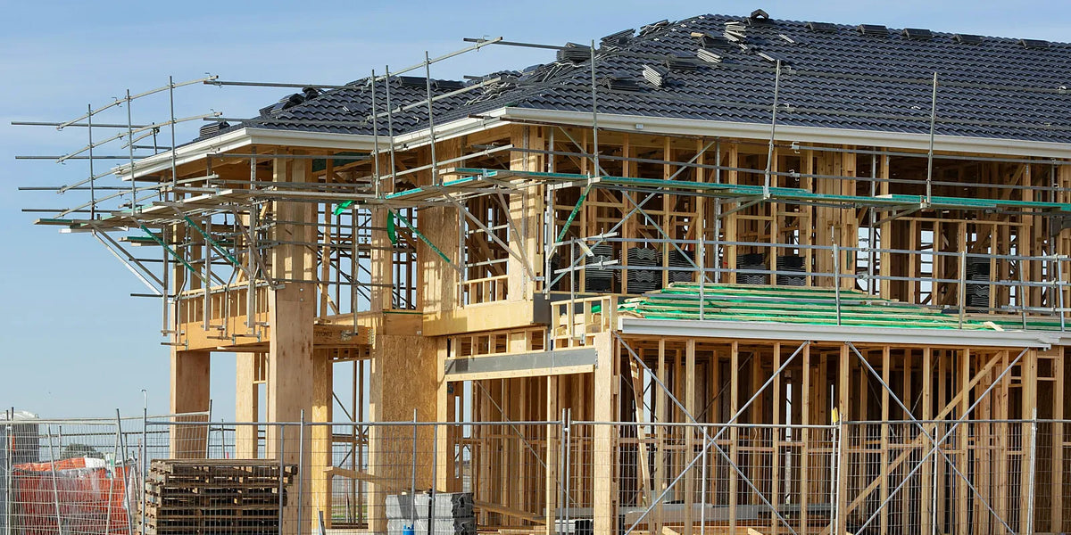 Two storey timber wall frame with scaffolding on an Australian house under construction