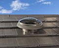 Bradford SolaBrite tubular skylight dome installed on a tiled roof