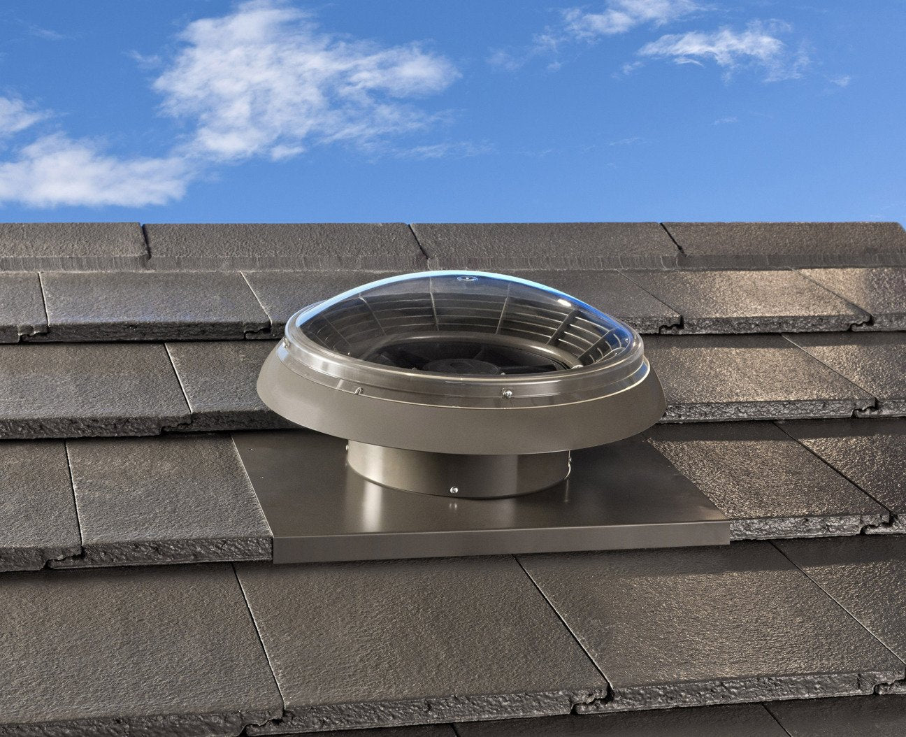 Bradford SolaBrite tubular skylight dome installed on a tiled roof