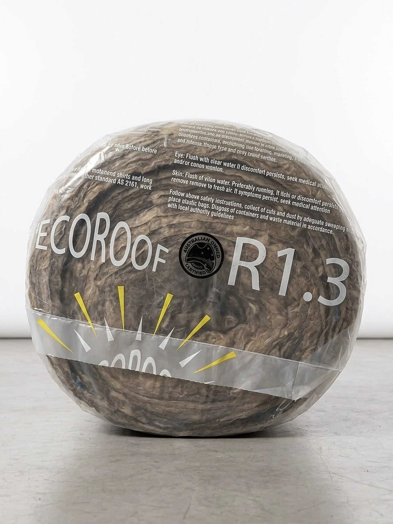 End of an EcoRoof R1.3 roofing blanket roll showing the glasswool core through the wrapping