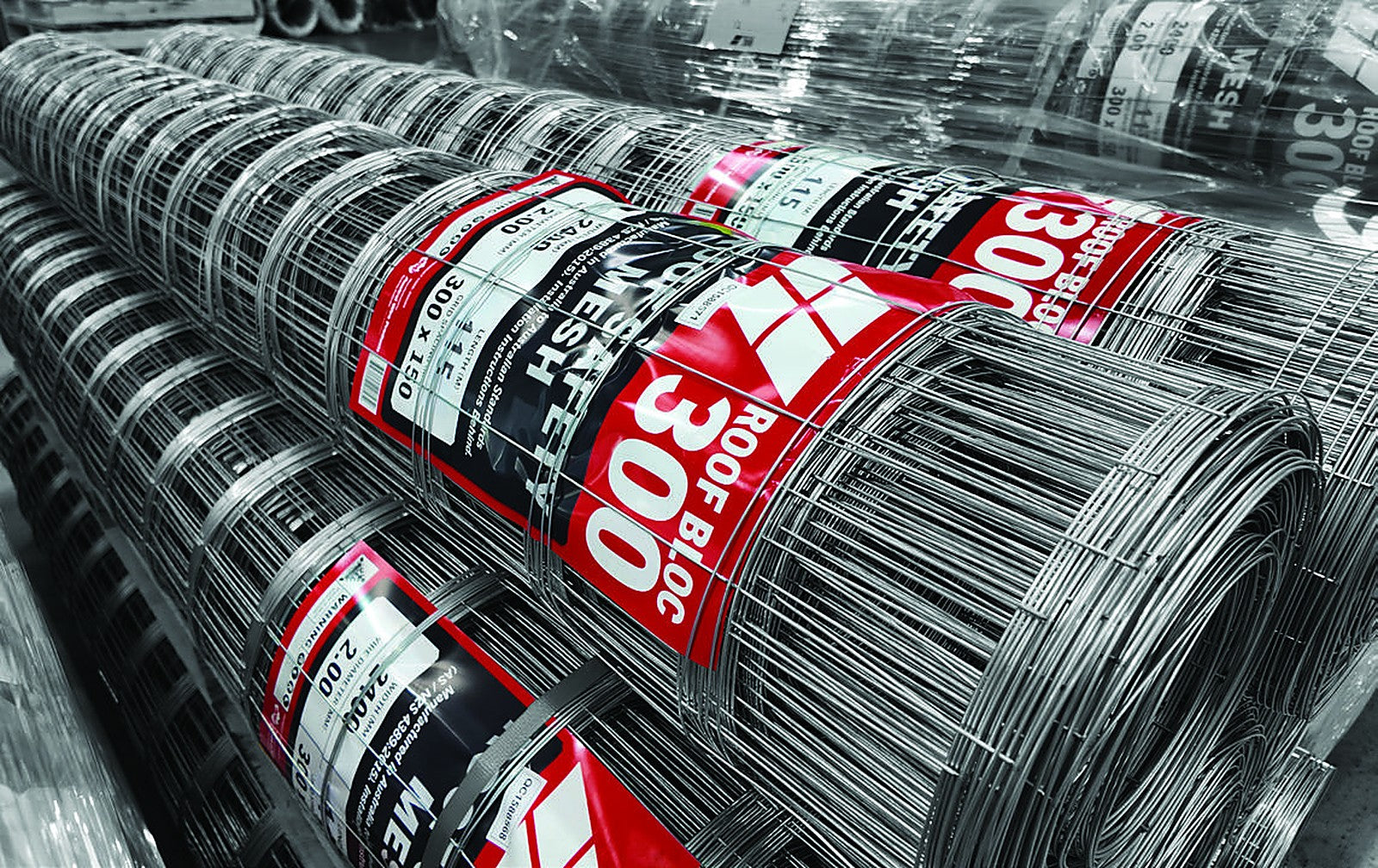 Rolls of Roof Bloc 300 galvanised roof safety mesh, 2.0 mm high tensile wire with 300 x 150 mm aperture, labelled and wrapped ready for delivery